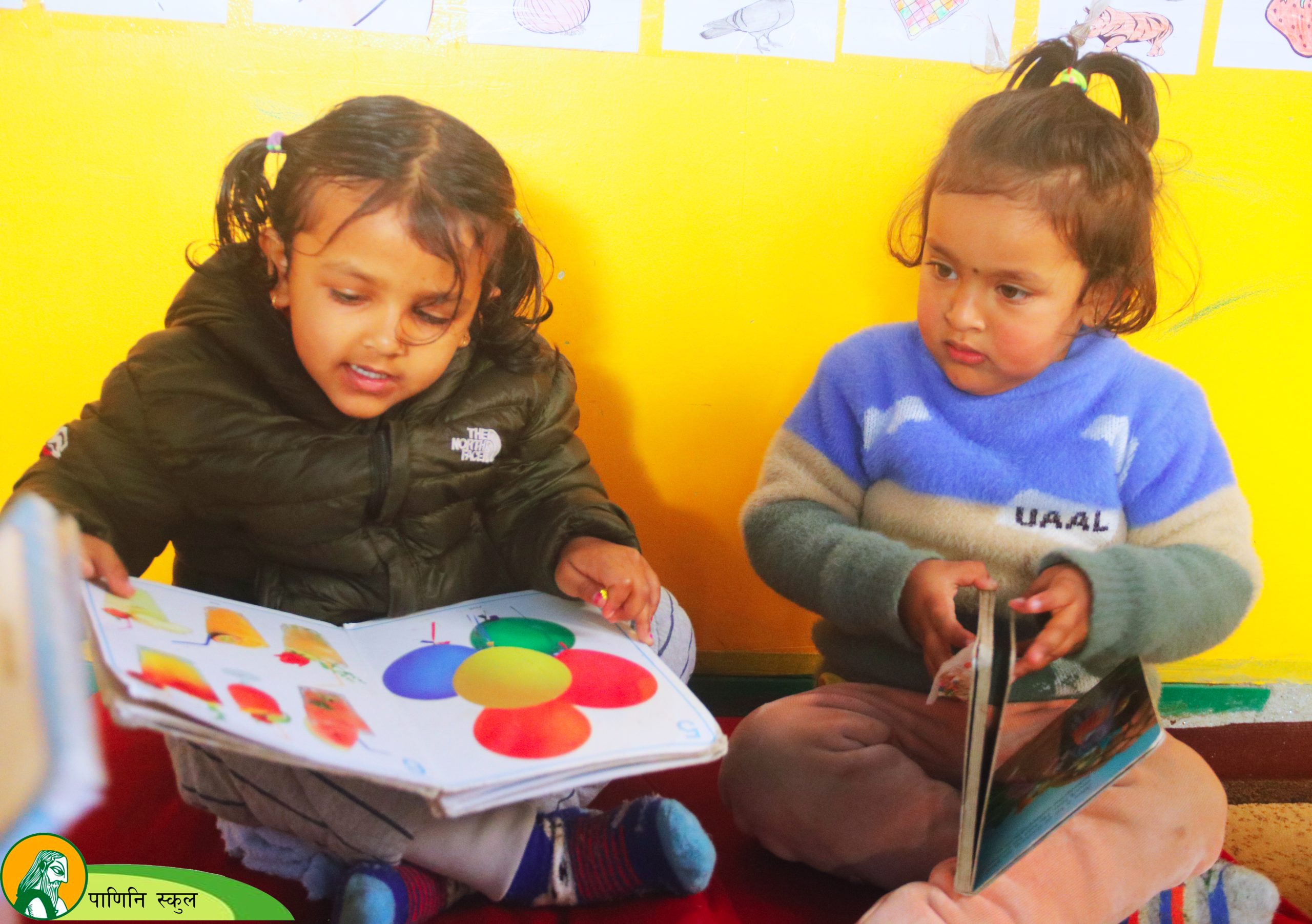 Children engaged in colorful mural painting activity at Panini Montessori